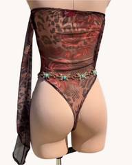 Mannequin wearing a leopard print bodysuit with sheer overlay